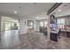 Bright, open living area with tile floors leading to a workspace and outdoor views at 689 Sea Star St, Henderson, NV 89002