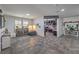 Spacious living area showcasing tile floors and a view into an adjacent room, blending comfort and functionality at 689 Sea Star St, Henderson, NV 89002