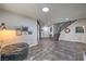 Open-concept living space with tile flooring, a staircase, and a well-lit, inviting atmosphere at 689 Sea Star St, Henderson, NV 89002