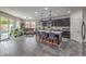 Spacious open-concept living area with kitchen island and doors leading to the backyard at 689 Sea Star St, Henderson, NV 89002