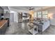 Comfortable living room featuring tile floors, neutral tones, and ample natural light at 689 Sea Star St, Henderson, NV 89002
