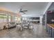 Spacious living area with tile flooring, comfortable seating, and a view into the kitchen at 689 Sea Star St, Henderson, NV 89002