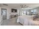 Spacious primary bedroom with walkout balcony and seating area with desk at 689 Sea Star St, Henderson, NV 89002