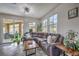 Relaxing sun room with sliding glass doors leading to the backyard patio and pool at 689 Sea Star St, Henderson, NV 89002