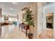 Open foyer featuring a decorative plant, access to the bathroom, and a spacious living room at 724 Smokey Mountain Ave, Henderson, NV 89012