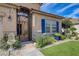 Close up of front entrance featuring a decorative wrought iron gate and manicured landscape at 724 Smokey Mountain Ave, Henderson, NV 89012