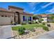 Beautiful house showcasing a well-maintained yard, rock accents, and a desert landscape at 724 Smokey Mountain Ave, Henderson, NV 89012