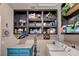 This organized laundry room offers custom storage and a washer/dryer at 724 Smokey Mountain Ave, Henderson, NV 89012