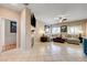 Spacious living room with fireplace, neutral décor, and large windows for natural light at 724 Smokey Mountain Ave, Henderson, NV 89012