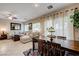 Spacious living room with dining area and large windows for natural light at 724 Smokey Mountain Ave, Henderson, NV 89012