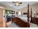 Well-lit main bedroom featuring a four-poster bed, hardwood floors and neutral decor at 724 Smokey Mountain Ave, Henderson, NV 89012
