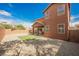 Backyard area with artificial turf, gravel, and block wall fencing at 7316 Childers Ave, Las Vegas, NV 89178
