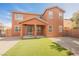 Outdoor patio boasts an artificial turf lawn and low-maintenance gravel landscaping at 7316 Childers Ave, Las Vegas, NV 89178