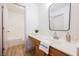 Bright bathroom features a single vanity, modern fixtures, and access to a tub and shower at 7316 Childers Ave, Las Vegas, NV 89178