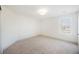 Empty bedroom with neutral carpet, a window, and recessed lighting, ready for personalization at 7316 Childers Ave, Las Vegas, NV 89178