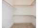 Spacious walk-in closet with carpet floors and multiple clothing rods for ample storage space at 7316 Childers Ave, Las Vegas, NV 89178