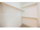 Walk-in closet offers ample storage space with white walls and wooden railings at 7316 Childers Ave, Las Vegas, NV 89178