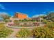 Beautiful entrance to Valla community with flower beds and shrubs at 7316 Childers Ave, Las Vegas, NV 89178