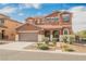 Charming two-story home featuring a two-car garage and meticulously landscaped front yard at 7316 Childers Ave, Las Vegas, NV 89178