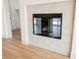 The fireplace features white tile surround, black trim and door, and a hearth at 7316 Childers Ave, Las Vegas, NV 89178