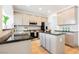 Modern kitchen with stainless steel appliances, granite countertops, and ample cabinet space at 7316 Childers Ave, Las Vegas, NV 89178