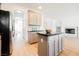 Kitchen island and stainless steel fridge provides a focal point and modern amenities at 7316 Childers Ave, Las Vegas, NV 89178