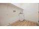Laundry room featuring a sink, cabinet, wooden floors, and modern hookups at 7316 Childers Ave, Las Vegas, NV 89178