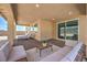Stylish back patio with lounge chairs, outdoor seating, and views of the backyard at 7665 Serenity Bay Ln # Lot 58, North Las Vegas, NV 89084