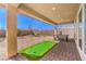 Outdoor patio with putting green, landscaping, and beautiful hardscape at 7705 Serenity Bay Ln # Lot 57, North Las Vegas, NV 89084