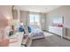 Bright bedroom with a large window, sleek white furniture, and modern decor at 7705 Serenity Bay Ln # Lot 57, North Las Vegas, NV 89084