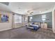 Spacious primary bedroom featuring neutral carpets, lots of natural light, and modern decor at 7705 Serenity Bay Ln # Lot 57, North Las Vegas, NV 89084
