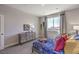 Bright bedroom with large window, neutral tones, modern furniture and decor at 7705 Serenity Bay Ln # Lot 57, North Las Vegas, NV 89084