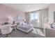 Charming bedroom features a stylish desk area, comfortable bed, and plenty of natural light at 7705 Serenity Bay Ln # Lot 57, North Las Vegas, NV 89084
