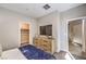 Bedroom showing built-in TV, walk-in closet, and modern decor at 7705 Serenity Bay Ln # Lot 57, North Las Vegas, NV 89084