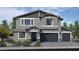 Charming two-story home featuring a two-car garage, well-maintained landscaping, and a welcoming entrance at 7705 Serenity Bay Ln # Lot 57, North Las Vegas, NV 89084