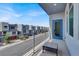Balcony view of the street and nearby townhomes under a clear, blue sky at 8060 Haywood Estate Ave, Las Vegas, NV 89113