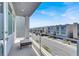 Balcony view of the street with nearby townhomes under a clear, blue sky at 8060 Haywood Estate Ave, Las Vegas, NV 89113