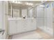 Bathroom featuring a double sink vanity and a glass-enclosed shower at 8060 Haywood Estate Ave, Las Vegas, NV 89113