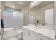 Bathroom featuring a single sink vanity and a shower-tub combo at 8060 Haywood Estate Ave, Las Vegas, NV 89113