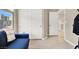 Bedroom with hardwood floors, view of stairs, and a seating area at 8060 Haywood Estate Ave, Las Vegas, NV 89113