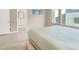 Bright bedroom with wood floors, ensuite bathroom and large window at 8060 Haywood Estate Ave, Las Vegas, NV 89113