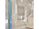 Bright entryway with a staircase and a modern chair at 8060 Haywood Estate Ave, Las Vegas, NV 89113