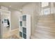 Open hallway with hardwood floors, storage cubbies and a staircase at 8060 Haywood Estate Ave, Las Vegas, NV 89113
