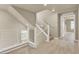 Hallway with wood floors and staircase with modern white railing at 8060 Haywood Estate Ave, Las Vegas, NV 89113