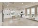 A gourmet kitchen with white cabinets, stainless steel appliances, and a center island at 8060 Haywood Estate Ave, Las Vegas, NV 89113