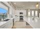 Modern kitchen boasts white countertops, stainless appliances, and a window view at 8060 Haywood Estate Ave, Las Vegas, NV 89113