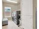 A laundry room with washer, dryer, and a view to the backyard at 8060 Haywood Estate Ave, Las Vegas, NV 89113