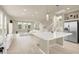 Open-concept living room and kitchen provide ample space for entertaining and Gathering gatherings at 8060 Haywood Estate Ave, Las Vegas, NV 89113