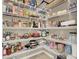 Walk-in pantry is fully stocked with ample storage and organization solutions at 8060 Haywood Estate Ave, Las Vegas, NV 89113