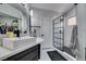 Modern bathroom with a square sink, spacious walk-in shower with glass door, and ample storage at 8150 Beaverbrook Way, Las Vegas, NV 89123